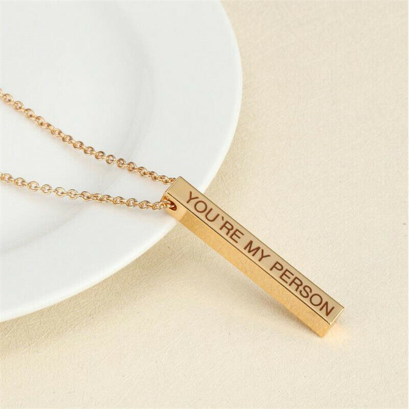 Personalised Name Bar Necklace Laying with Plate